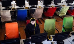 A customer uses a computer in an internet cafe at Changzhi, Shanxi