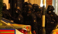 Armed police gather to end a stand-off with an armed man in King's Road, in west London