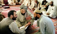 Ahmed Wali Karzai, the Afghan president's half-brother, speaks with tribal leaders