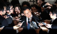 Toyota Motor Corp president Akio Toyoda is surrounded by reporters in Tokyo in February 2010