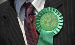 A rosette on a Green party worker canvassing in the Primrose Grove area of Norwich