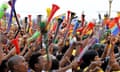 World Cup 2010 spectators wave their vuvuzela horns while watching the opening game