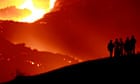 People watch the erupting Pacaya volcano in Guatemala