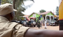 Ugandan police secure the site of the Ethiopian Village restaurant in Kampala