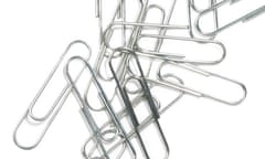 paper clips piled on each other on white