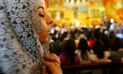 Woman praying in an Amman church