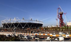 The final giant steel loop swings into place to complete the ArcelorMittal Orbit sculpture. 