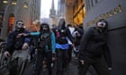 Occupy Wall Street demonstrators stage a march dressed as corporate zombies.