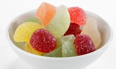 Sugar-coated fruit jelly sweets in white bowl