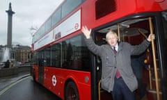 Mayor of London Boris Johnson waves from the back of a prototype of a new style London bus in London