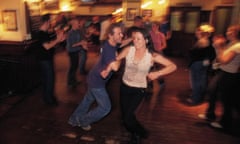 Dancers enjoy an energetic reel at a ceilidh night