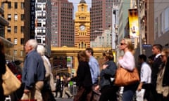 Office workers crossing street in downtown Melbourne