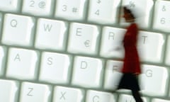 A woman walks past a big keyboard poster