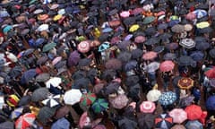 Crowd and umbrellas