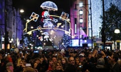 Merry shopping: A crowd watches the Oxford Street Christmas lights being switched on in central London.