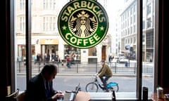 City worker on laptop in Starbucks coffee shop Monument London. Photo:Jeff Gilbert