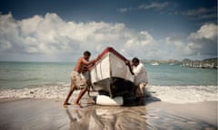 Fishermen bringing a boat in