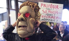 A protester dressed as Jean Charest, the Quebec premier