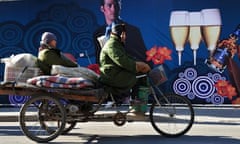 Migrants on a flatbed tricycle