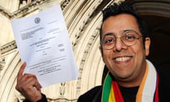 Science writer Simon Singh smiles outside the high court, London after winning his legal battle