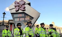 Police secure the Olympic countdown cloc