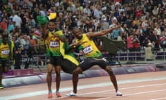 Bolt (R) and Blake celebrate the Jamaican team's gold medal in the 4 x 100m men's relay - the final athletics event in the Olympic stadium.