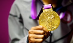 Gold! American sprinter Sanya Richards-Ross poses with her 400 meter gold medal at a press conference this morning. Photograph:Mark Makela/ZUMA Press/Corbis