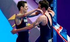 Alistair Brownlee (right) embraces his brother Jonny after winning gold and bronze in the triathlon