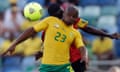 South Africa's Tokelo Rantie is challenged by Angola's Dany Massunguna