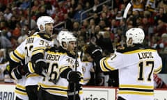 Boston Bruins' Zdeno Chara is congratulated after scoringl against the Carolina Hurricanes