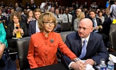 Former Arizona Representative Gabrielle Giffords, who was seriously injured in the mass shooting that killed six people in Tucson, Arizona two years ago, sits with her husband, Mark Kelly on Capitol Hill in Washington. Giffords is speaking before the Senate Judiciary Committee hearing on what lawmakers should do to curb gun violence in the wake of last month's shooting rampage at that killed 20 schoolchildren in Newtown.