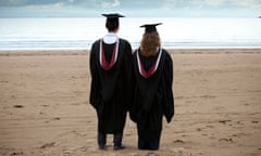 graduates on the beach