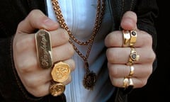 Girl wearing gold sovereign rings and gold chains