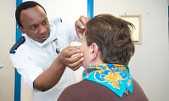 Nurse giving eye injection