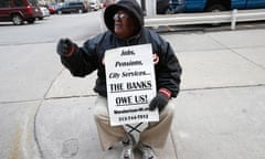 A pensioner protests pensions cuts in Detroit