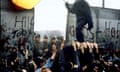 West Berliners break down a section of the Berlin Wall