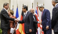 German foreign minister Guido Westerwelle, EU foreign policy chief Catherine Ashton, Chinese foreign minister Wang Yi, Iranian foreign minister Mohammad Javad Zarif, US secretary of state John Kerry and French foreign minister Laurent Fabius shake hands after the deal.