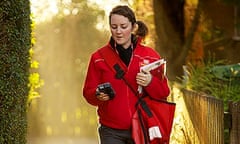 Postwoman Lora Craig delivering letters and parcels on her round in Earby, Lancashire