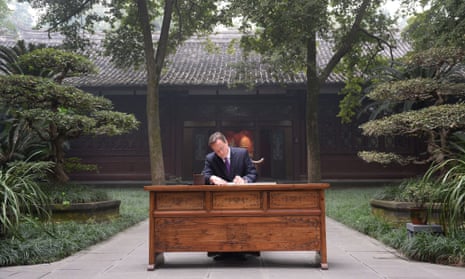 David Cameron signs a visitor's book the home of the Chinese author and poet Du Fu in Chengdu, as part of his three day visit to China.