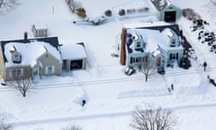 People dig out from a very heavy snowfall, near Hamden, Connecticut, in the aftermath of a storm that hit the state and much of the New England.