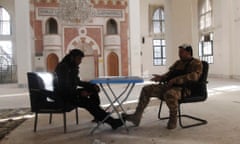 Members of the Free Syrian Army chat in a mosque near Nairab military airport in Aleppo on Tuesday.