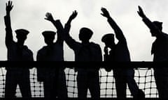 silhouette of sailors with hands in air