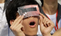A South Korean student uses a special glass to observe the transit of Venus on June 6 2012