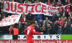 Liverpool fans hold up banners calling for justice for the Hillsborough victims