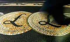 Employee walking over a mosaic depicting pound sterling symbols