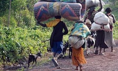 Refugees flee fighting between rebel M23 forces and forces loyal to the government near Goma, DRC