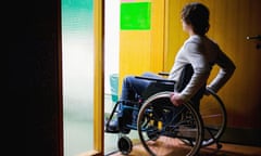 Disabled man in wheelchair in doorway