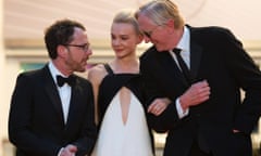 Ethan Coen, Carey Mulligan and musician T-Bone Burnett leave Sunday evening's screening of Inside Llewyn Davis at Cannes