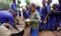 Children queue for lunch at Tanzanian school