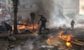 Reporters run for cover during clashes between supporters of Egypt's ousted president Mohamed Morsi, and police yesterday at the Rabaa al-Adawiya camp in east Cairo